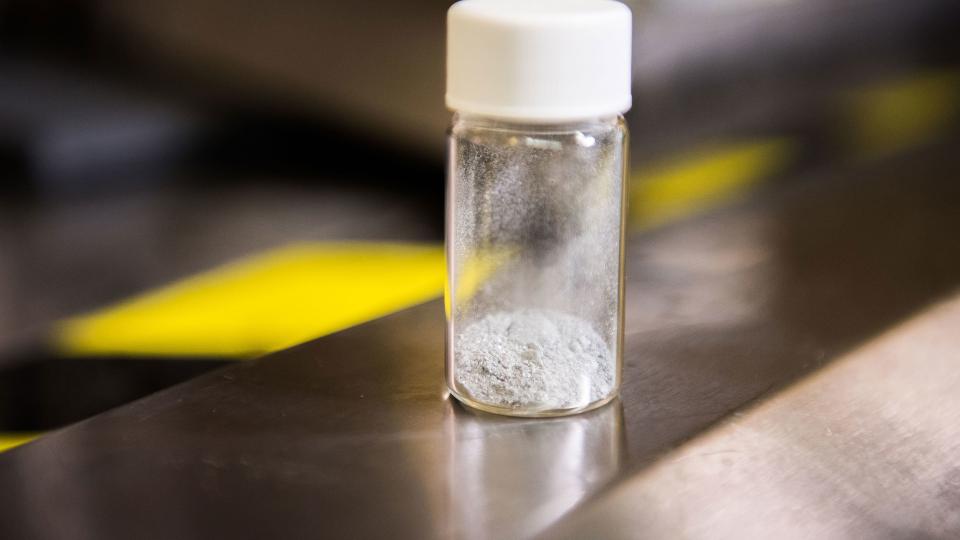<p>Scientists at the Army Research Laboratory found that an aluminum-based powder prompts hydrogen to split from water. Now, a Georgia Tech-led partnership will carry that research forward. Credit: US Army</p> a small vial of white powder